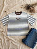 Jesus Is King striped tee flat lay